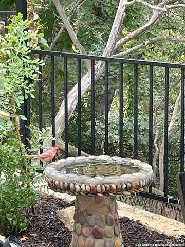 a balcony with table and chairs