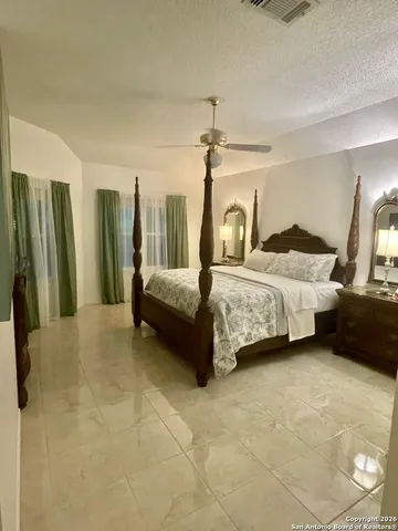 a bedroom with a bed and a walk in closet