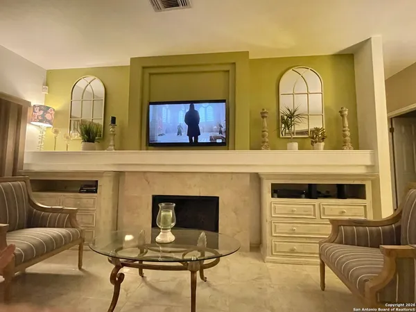 a living room with furniture and a window