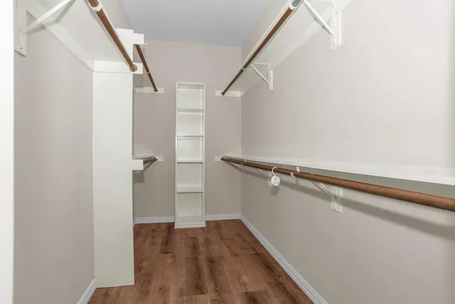 a kitchen with stainless steel appliances granite countertop a stove microwave and sink