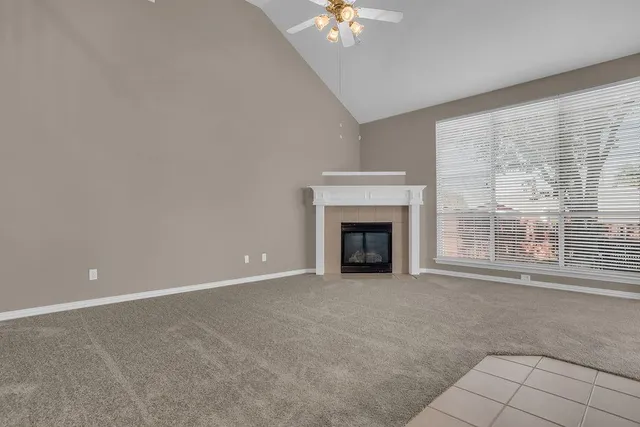 a view of a living room with furniture and a flat screen tv