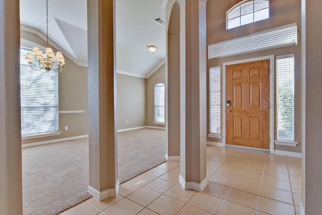 a view of a bathroom from a corridor