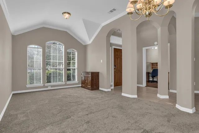 a workspace with furniture and a window