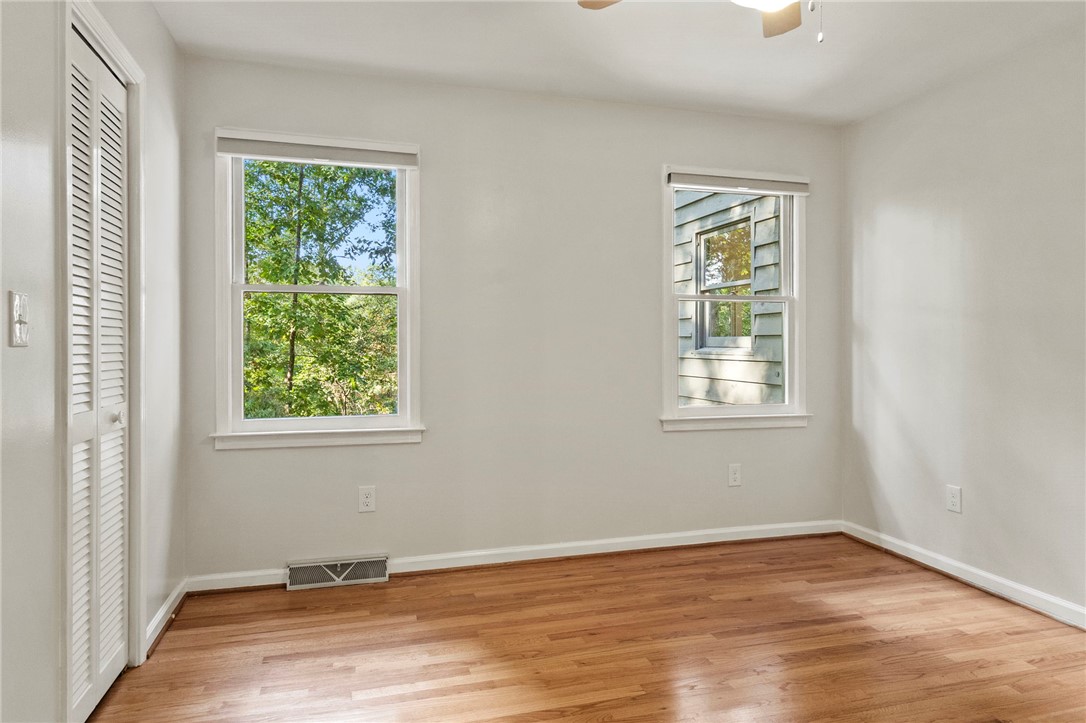 225 Arrowhead Trail Easley, SC 29642 - Photo 27 of 33 This bright room features beautiful hardwood floors and ample natural light from two large windows.