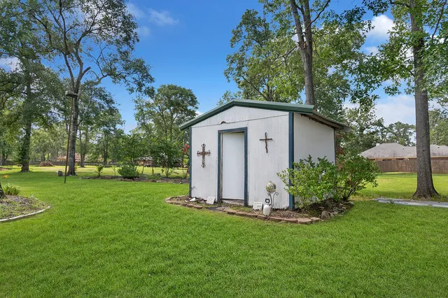 a garden with trees in the background