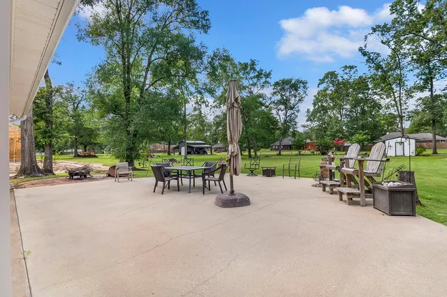 a view of a house with a yard and plants