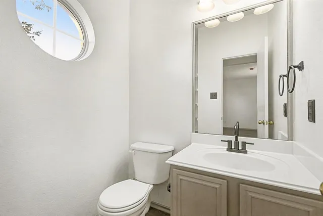 a spacious bedroom with a bed and furniture