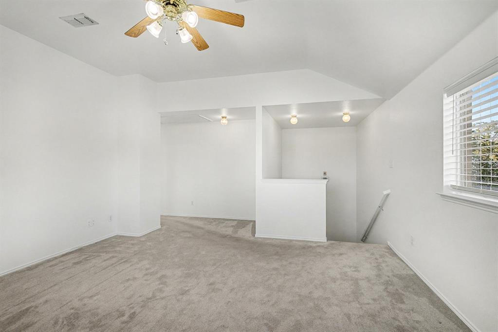 415 Hidden Ridge Drive Burleson, TX 76028 - Photo 17 of 38 wooden floor in an empty room with a window