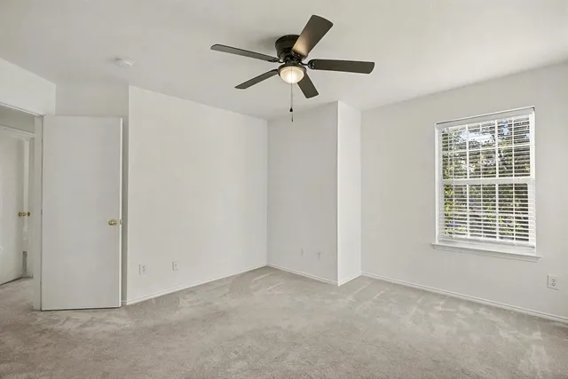 a view of a porch with a table and chairs