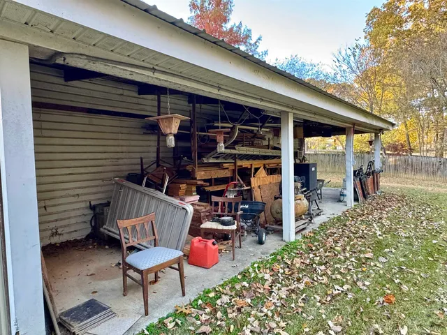 a view of a patio with table and chairs and potted plants
