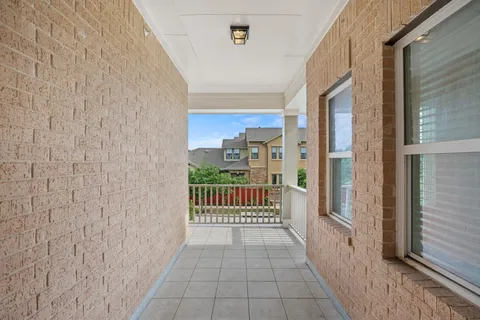 a view of a balcony with a door