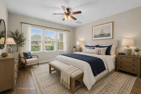 a bedroom with a large bed and a couch
