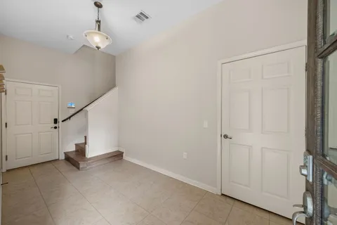 a view of a livingroom with stairs