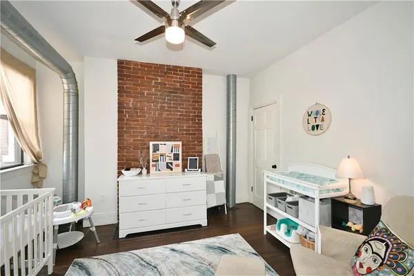 a bedroom with furniture and a window