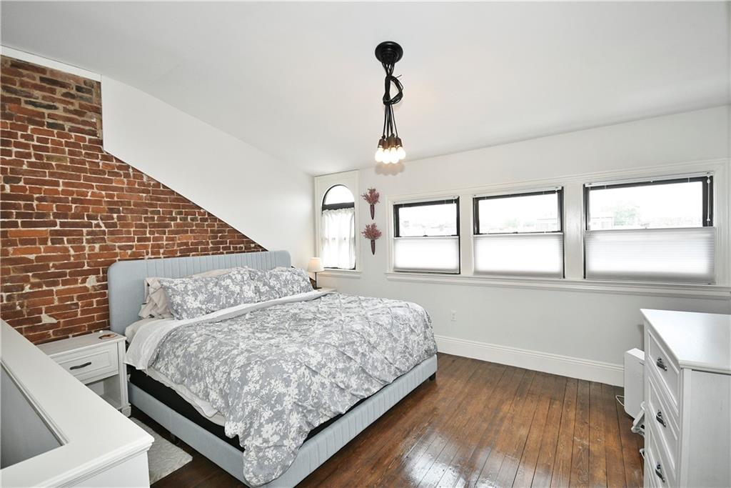 149 Home Street Pittsburgh, PA 15201 - Photo 12 of 14 a bedroom with a bed and window