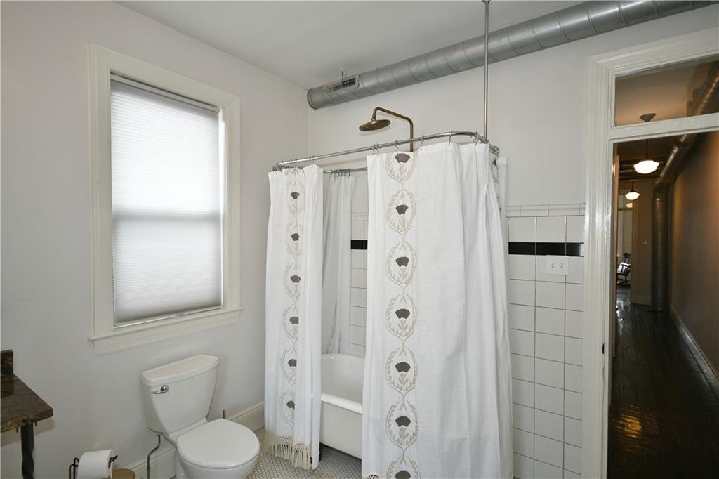 149 Home Street Pittsburgh, PA 15201 - Photo 5 of 14 a bathroom with a shower a toilet and a sink