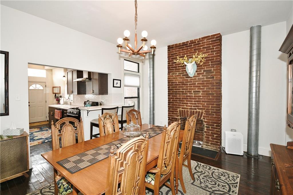 149 Home Street Pittsburgh, PA 15201 - Photo 6 of 14 a view of a dining room with furniture and a chandelier