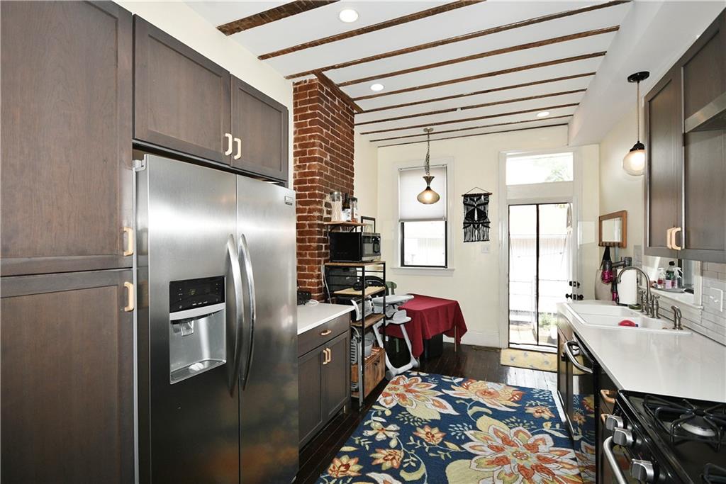 149 Home Street Pittsburgh, PA 15201 - Photo 9 of 14 a kitchen with stainless steel appliances granite countertop a refrigerator and a stove
