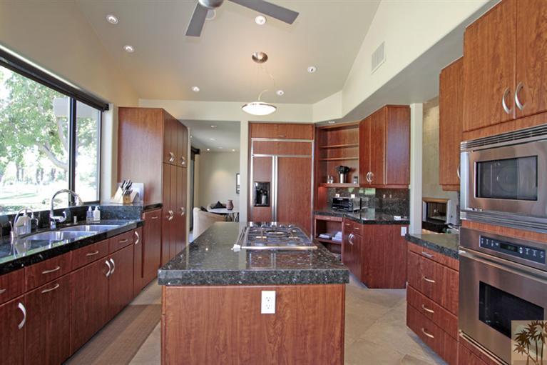 320 Red River Road Palm Desert, CA 92211 - Photo 1 of 31 a large kitchen with granite countertop a large counter top cabinets appliances and a center island