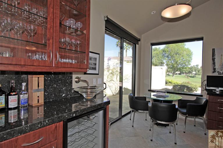 320 Red River Road Palm Desert, CA 92211 - Photo 13 of 31 a kitchen with a table and chairs in it