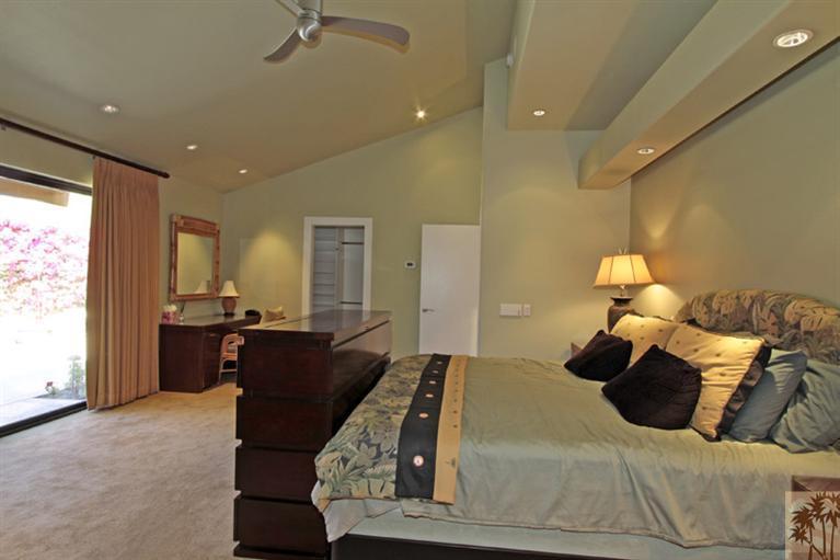 320 Red River Road Palm Desert, CA 92211 - Photo 15 of 31 a large bedroom with a large bed and furniture