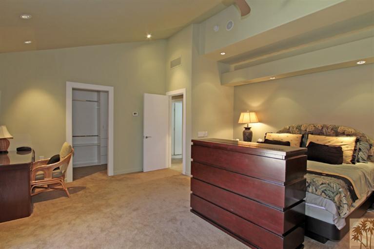 320 Red River Road Palm Desert, CA 92211 - Photo 16 of 31 a bed room with a bed and a chair