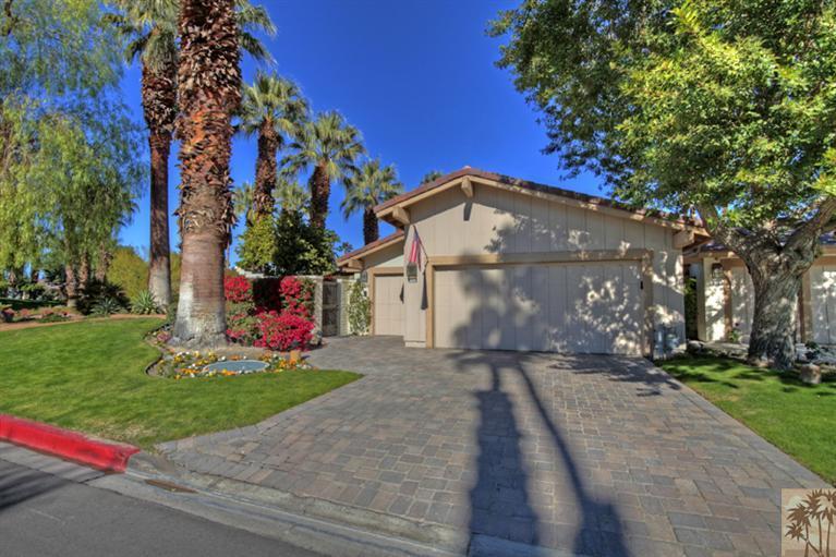 320 Red River Road Palm Desert, CA 92211 - Photo 3 of 31 a front view of a house with a yard