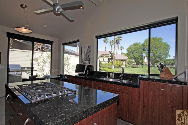 320 Red River Road Palm Desert, CA 92211 - Photo 8 of 31 a kitchen with large windows sink and stove