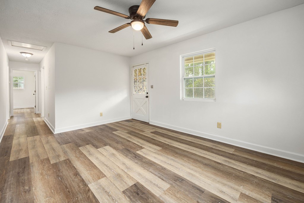 246 Sunnyside Church Road Pine Mountain, GA 31822 - Photo 5 of 26 a view of a livingroom with wooden floor and a ceiling fan