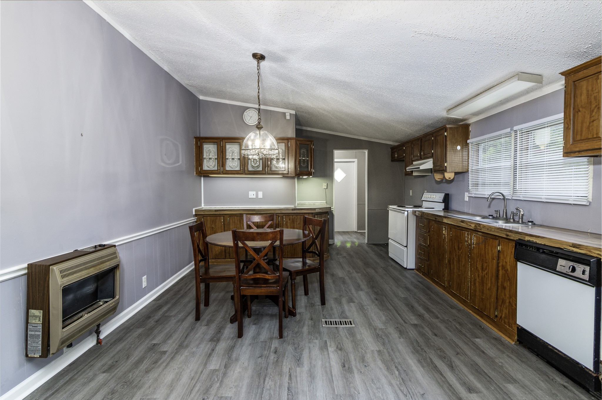 2583 Double Branch Road Columbia, TN 38401 - Photo 11 of 17 a kitchen with a dining table chairs stainless steel appliances and cabinets