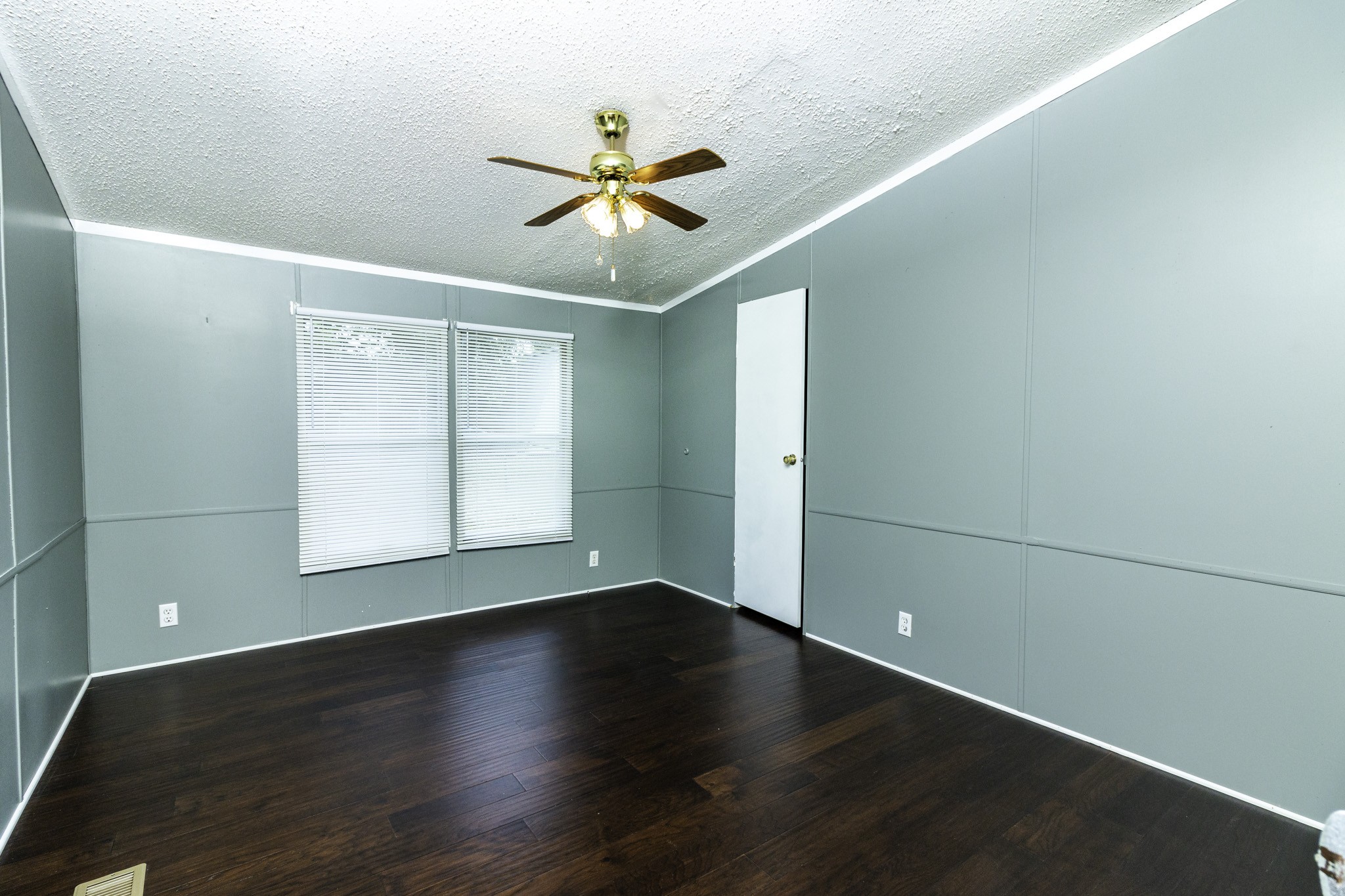 2583 Double Branch Road Columbia, TN 38401 - Photo 15 of 17 an empty room with wooden floor fan and windows