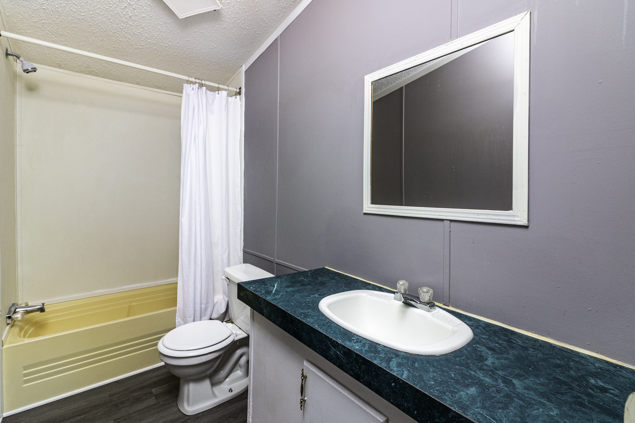 2583 Double Branch Road Columbia, TN 38401 - Photo 16 of 17 a bathroom with a granite countertop sink toilet and shower