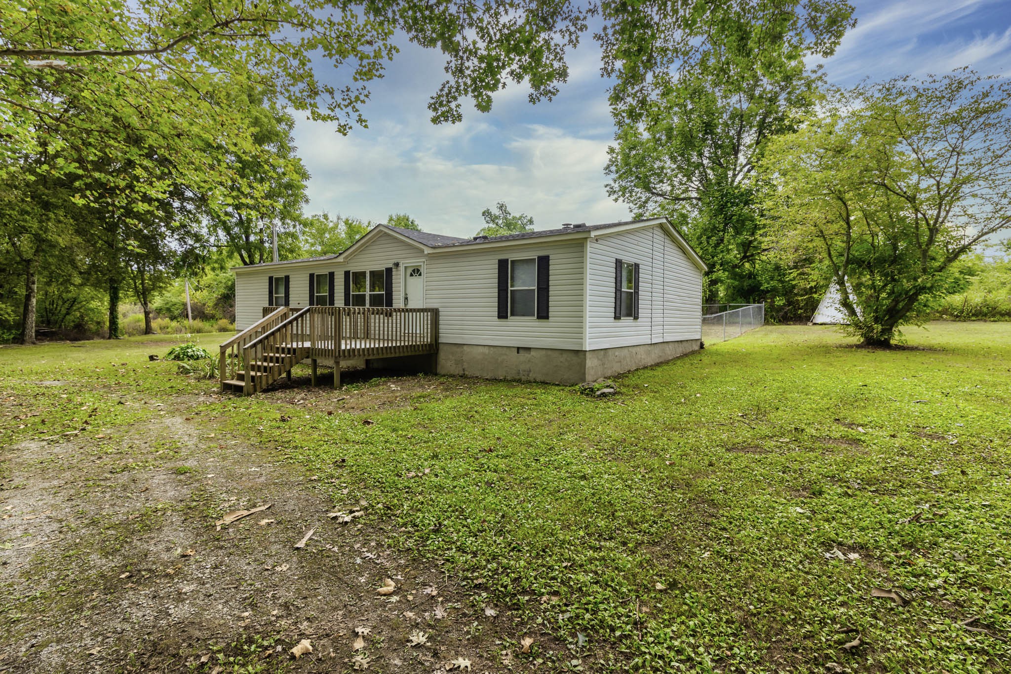 2583 Double Branch Road Columbia, TN 38401 - Photo 5 of 17 a view of a house with a big yard and large trees