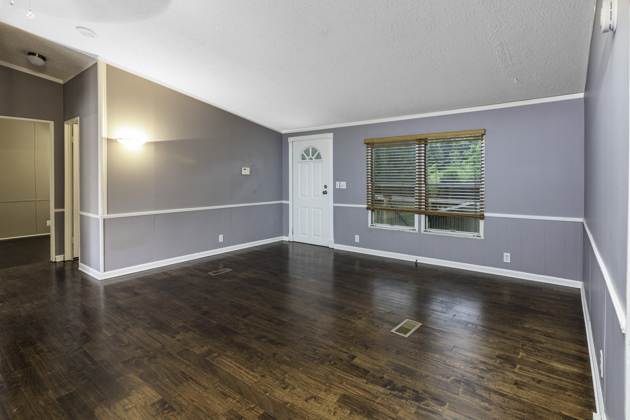 2583 Double Branch Road Columbia, TN 38401 - Photo 8 of 17 an empty room with wooden floor and windows