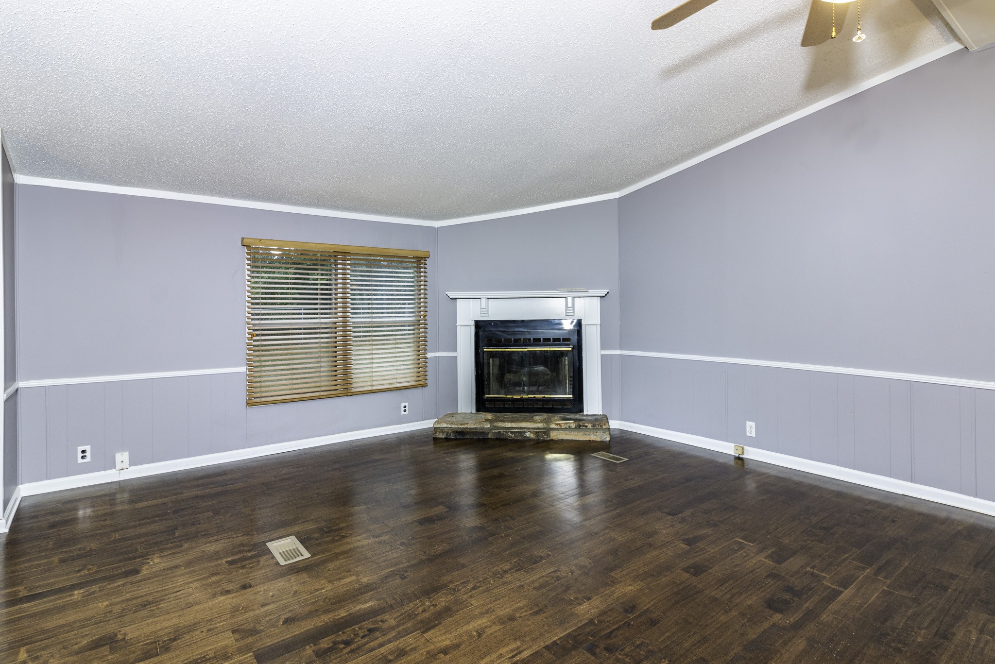 2583 Double Branch Road Columbia, TN 38401 - Photo 10 of 17 wooden floor in an empty room with a fireplace
