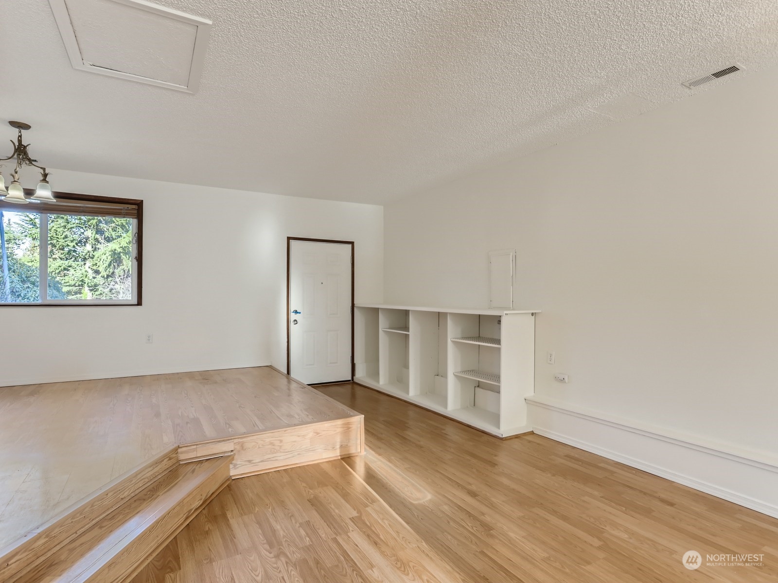 22031 7th Avenue West Bothell, WA 98021 - Photo 12 of 30 an empty room with wooden floor and windows