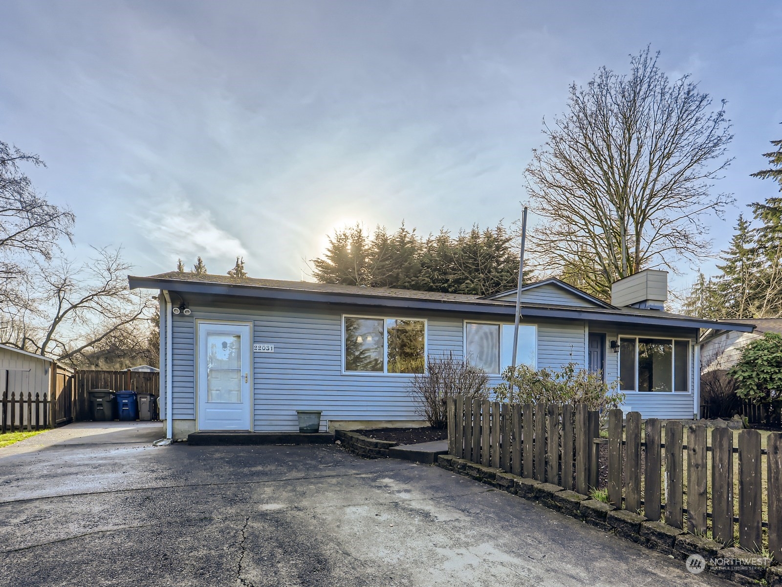 22031 7th Avenue West Bothell, WA 98021 - Photo 2 of 30 a view of a house with wooden fence and a large tree
