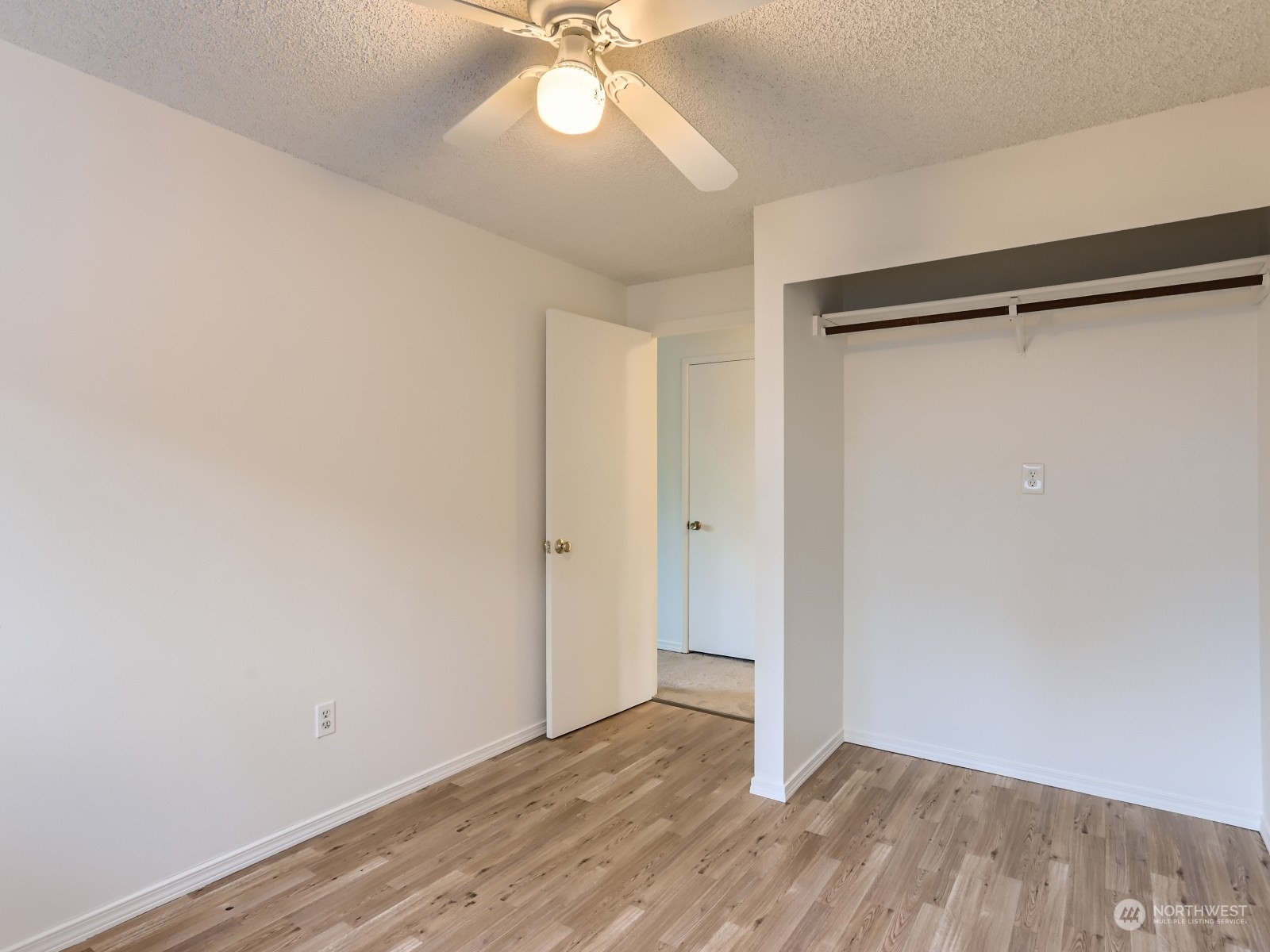 22031 7th Avenue West Bothell, WA 98021 - Photo 23 of 30 a view of an empty room with wooden floor