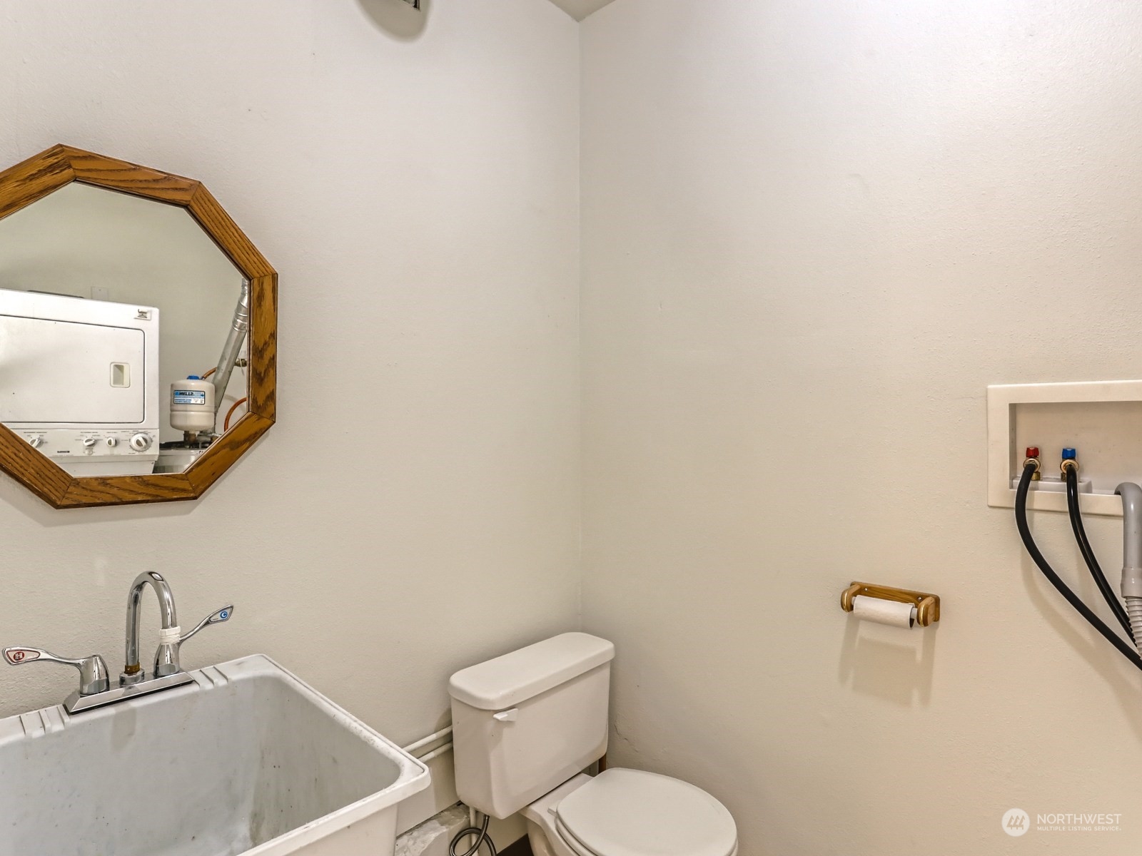 22031 7th Avenue West Bothell, WA 98021 - Photo 25 of 30 a bathroom with a toilet sink and mirror