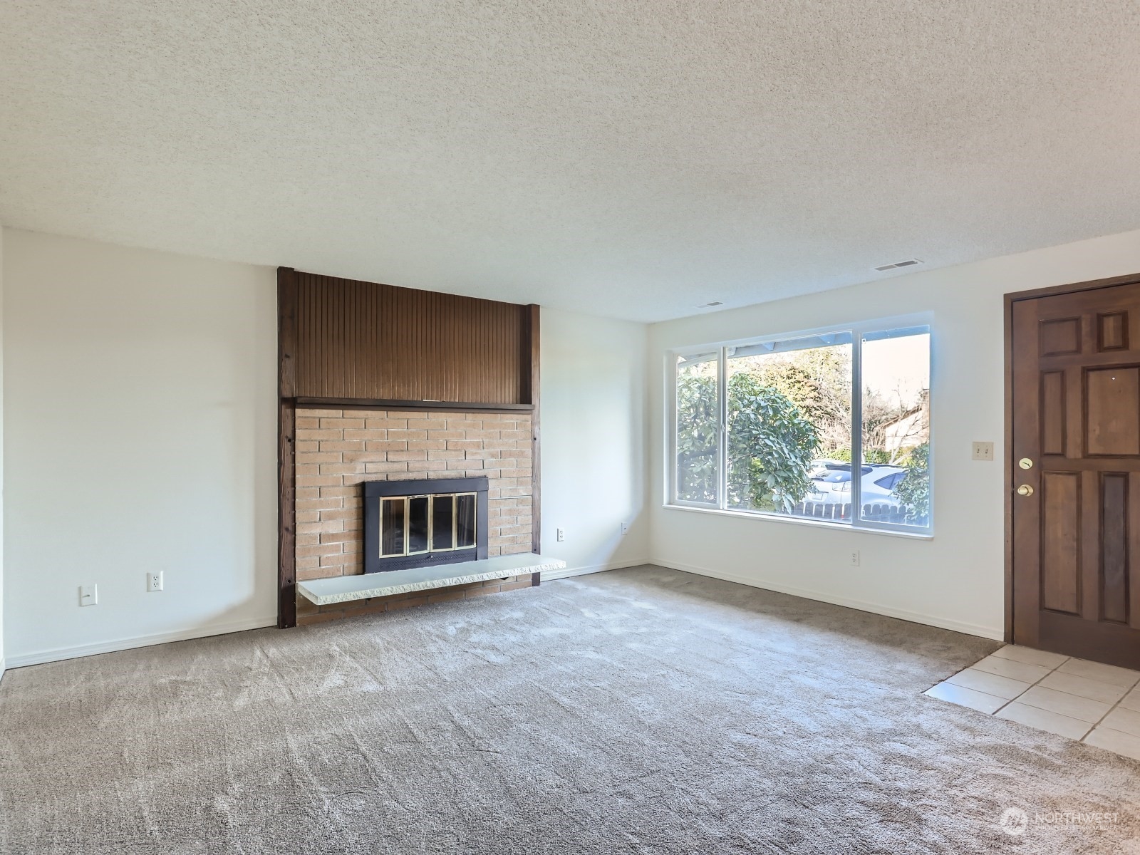 22031 7th Avenue West Bothell, WA 98021 - Photo 4 of 30 an empty room with windows and fireplace