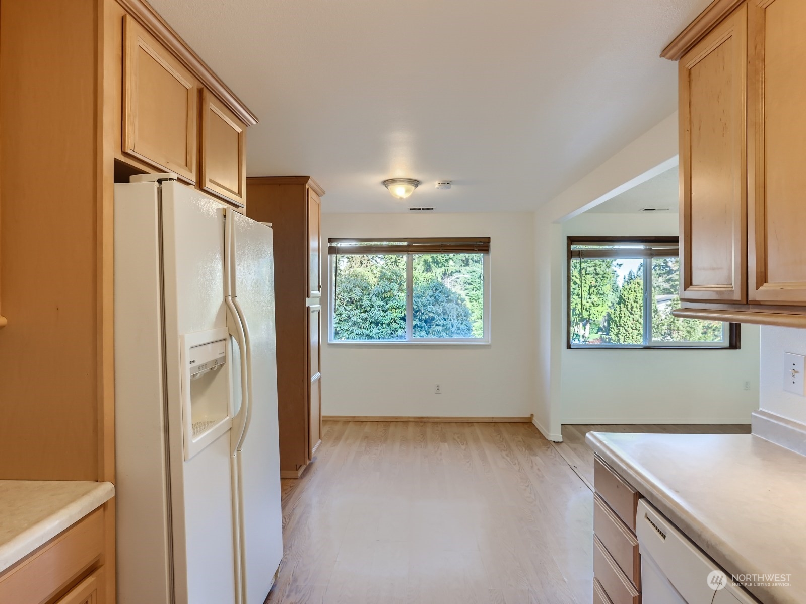 22031 7th Avenue West Bothell, WA 98021 - Photo 9 of 30 a kitchen with windows and refrigerator