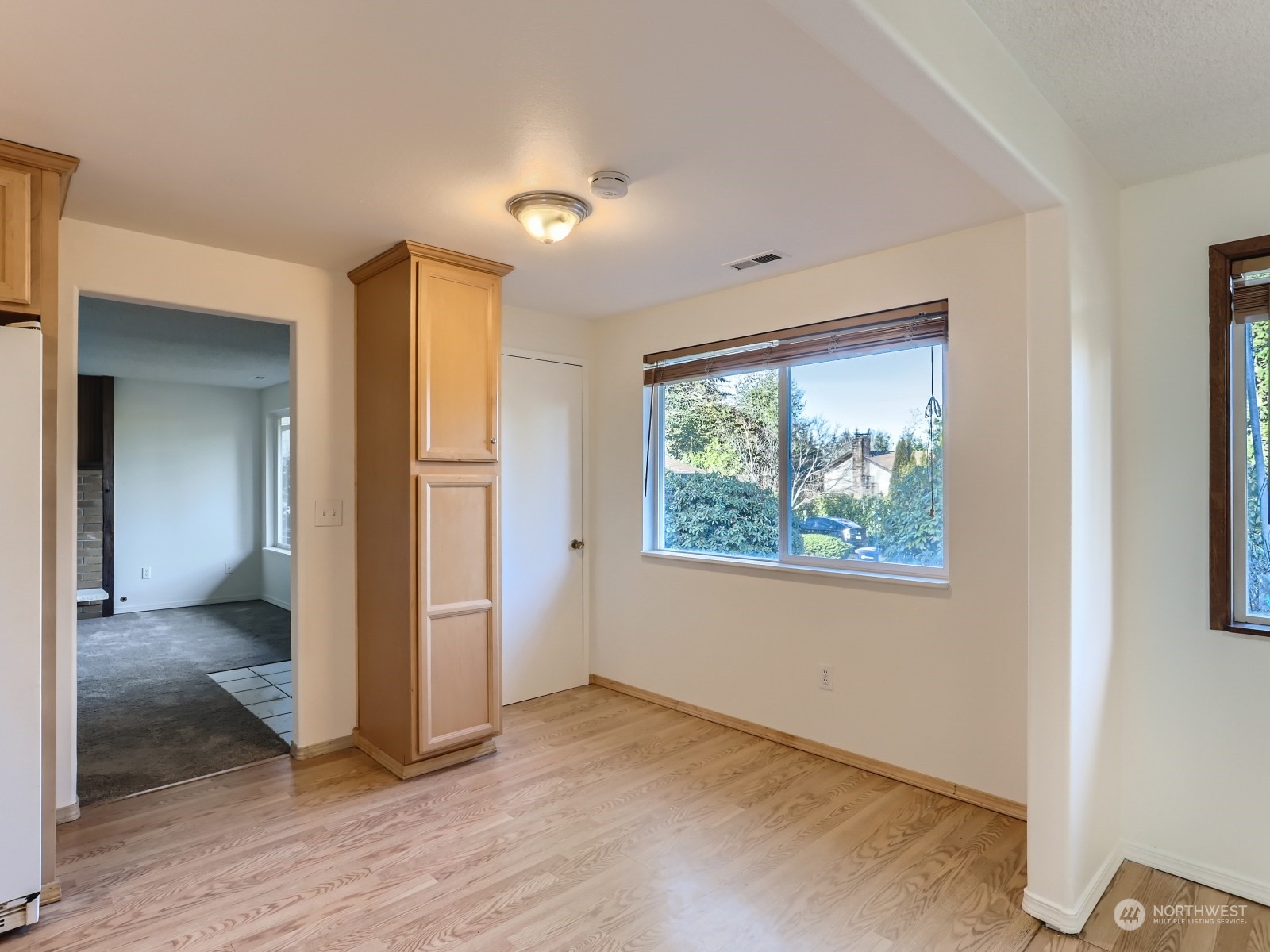 22031 7th Avenue West Bothell, WA 98021 - Photo 10 of 30 an empty room with wooden floor and a window