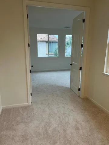 a bedroom with a bed and wall painting