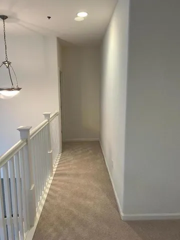 a bedroom with a bed and a desk