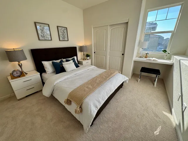 a white toilet sitting next to a bath tub