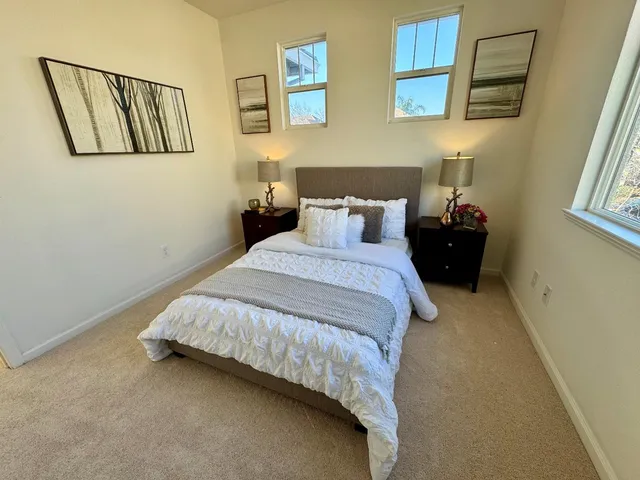 a white toilet sitting next to a bathroom sink