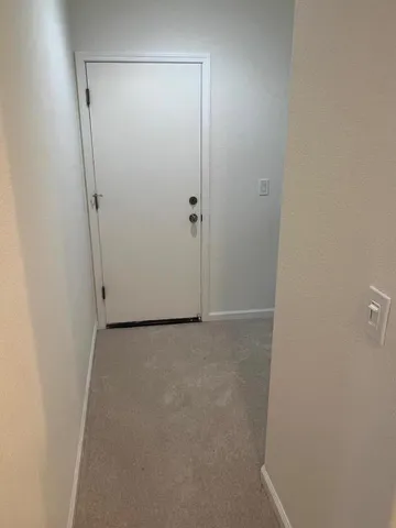 a dining room with furniture a rug and a chandelier