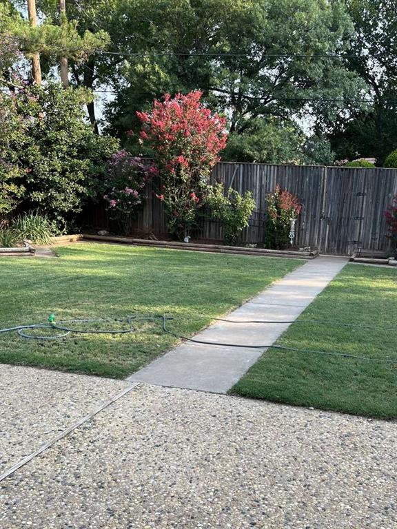 3212 40th Street Lubbock, TX 79413 - Photo 2 of 6 a backyard of a house with lots of green space