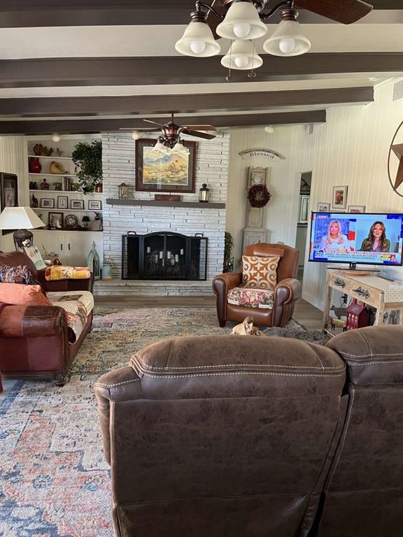 3212 40th Street Lubbock, TX 79413 - Photo 3 of 6 a living room with furniture and a fireplace