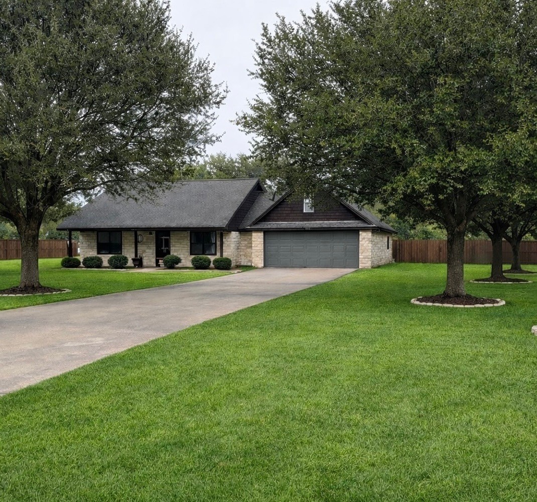 3597 Open Range Court Bryan, TX 77808 - Photo 2 of 8 a front view of house with yard and green space